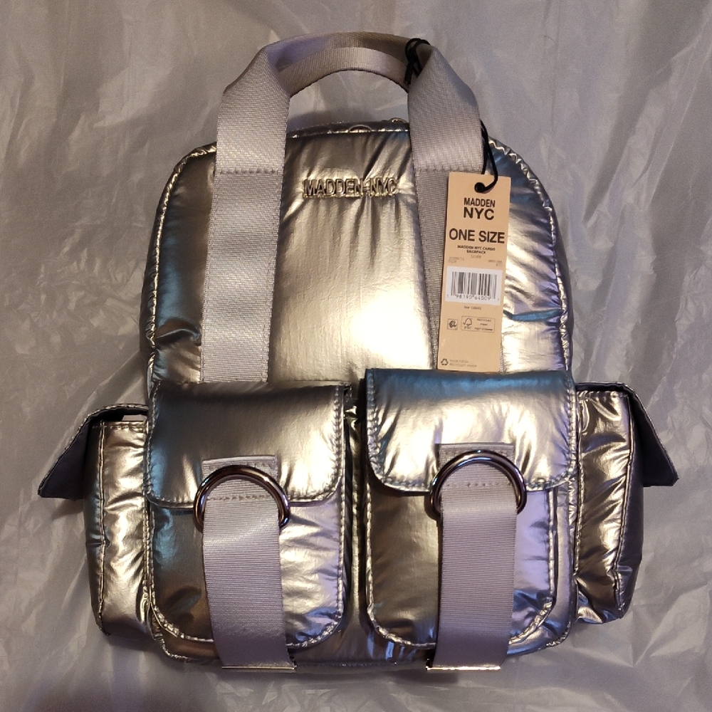 Steve Madden Silver Backpack. Front and side pockets.